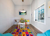 Thumbnail 52 of 67 - a dining room with a table and chairs and a large window