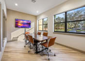 Thumbnail 39 of 67 - a conference room with a table and chairs and a large window