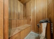 Thumbnail 4 of 11 - a wood paneled bathroom with a shower and a sink