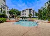 Thumbnail 23 of 32 - our apartments have a resort style pool with lounge chairs