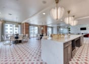 Thumbnail 1 of 16 - a large kitchen with a marble counter top and a dining room