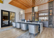 Thumbnail 7 of 16 - a large dining room with a marble table and chairs