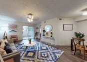Thumbnail 1 of 32 - a living room with a blue and white rug and a couch