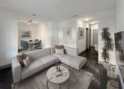 Thumbnail 10 of 33 - a living room with a white couch and a glass coffee table