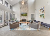 Thumbnail 10 of 26 - a living room with couches chairs and a fireplace
