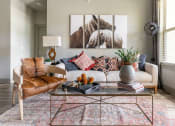 Thumbnail 5 of 23 - a living room filled with furniture and a large window