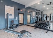 Thumbnail 15 of 39 - A gym with a sign that says "You are stronger than you think".