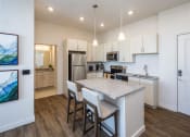 Thumbnail 16 of 45 - a kitchen with a marble counter top
