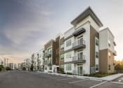 Thumbnail 38 of 45 - a row of new apartment buildings on a street