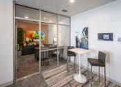 Thumbnail 4 of 45 - a dining room with a table and chairs in front of a mirrored wall