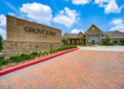 Thumbnail 17 of 17 - a large brick building with a driveway in front of it