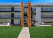 Thumbnail 19 of 22 - an exterior view of a building with a lawn and a staircase