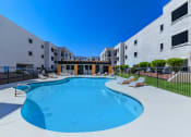 Thumbnail 18 of 22 - our apartments have a large resort style pool with lounge chairs
