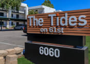 Thumbnail 14 of 22 - a sign for the tides on 651 in front of a building