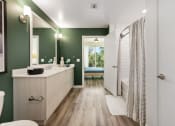 Thumbnail 20 of 66 - a bathroom with green walls and a shower and a sink