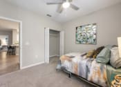 Thumbnail 25 of 67 - an open bedroom with a bed and a ceiling fan