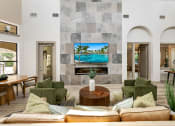 Thumbnail 31 of 67 - a living room with couches and chairs and a tv on the wall