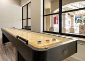 Thumbnail 41 of 67 - a billiards table in a game room with windows