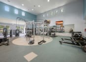 Thumbnail 51 of 67 - the gym at the flats at obsidian development has weights machines and other exercise equipment