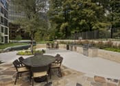 Thumbnail 10 of 23 - a patio with a table and chairs in a courtyard