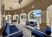 Thumbnail 62 of 67 - a lounge area with couches and chairs and a pool