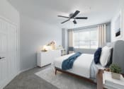 Thumbnail 23 of 39 - a bedroom with a bed and a ceiling fan