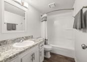Thumbnail 11 of 29 - a bathroom with a sink and a toilet and a shower