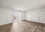 Thumbnail 7 of 29 - an empty living room with a door to a patio