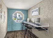 Thumbnail 14 of 29 - a home office with a desk and a window
