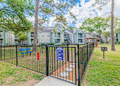 Thumbnail 38 of 51 - A gated community with a sign and a fire hydrant.
