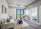 Thumbnail 35 of 35 - A modern living room with a large window and a view of the outdoors.