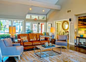 Thumbnail 7 of 22 - a living room with couches chairs and a table