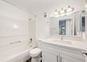 Thumbnail 38 of 42 - a bathroom with a sink toilet and a bath tub