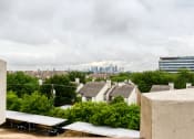 Thumbnail 12 of 13 - the view of the city skyline from the roof of a building