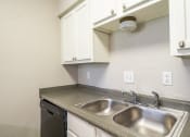Thumbnail 6 of 26 - a kitchen with a sink and a dishwasher