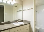 Thumbnail 9 of 26 - a bathroom with a sink and a toilet