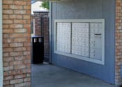 Thumbnail 19 of 26 - the front door of a building with a mail box on it