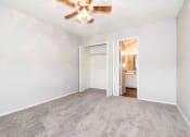 Thumbnail 7 of 36 - an empty living room with a ceiling fan