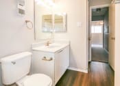 Thumbnail 4 of 36 - a bathroom with a toilet and a sink and a mirror