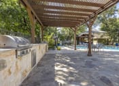 Thumbnail 25 of 39 - grill area in san antonio apartments