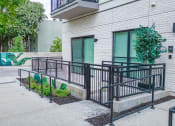 Thumbnail 37 of 41 - a building with a ramp leading up to the door