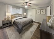 Thumbnail 8 of 29 - a bedroom with a bed and a ceiling fan