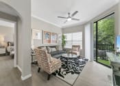Thumbnail 7 of 32 - a living room with a couch and two chairs