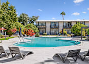 Thumbnail 3 of 29 - pool with chairs.