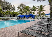 Thumbnail 11 of 42 - Outdoor pool with lounge seating