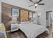 Thumbnail 5 of 22 - a bedroom with a bed and a ceiling fan