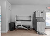 Thumbnail 14 of 22 - a hospital room with a bed and a refrigerator