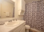 Thumbnail 8 of 27 - a bathroom with a sink and a toilet
