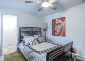 Thumbnail 10 of 27 - the preserve at ballantyne commons bedroom with bed and ceiling fan