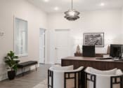 Thumbnail 11 of 29 - a home office with a desk and three chairs